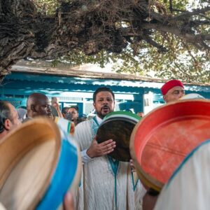 Men playing music at village in Tunis governorate
